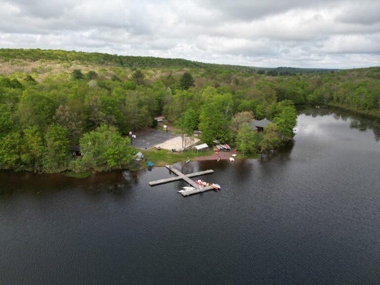Arial view of a camp on a lake